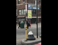 Boy wears blue suit and trump mask 