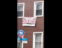 Submitter shows house sign hanging on wall