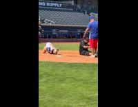 Woman runs at softball tripped by man