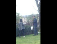 Man bend for angle photo shoot public park