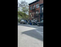 Collab WINY - Man in the street walks and drags weighted plates with chain