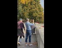 Man striped shirt throw dried leaves windy