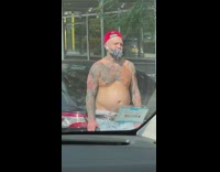 Shirtless guy wearing red hat moves chest 