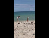 Girl polka dots bikini crawl lay beach part 1