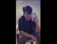 Guy sings makes gagging noise by mirror 