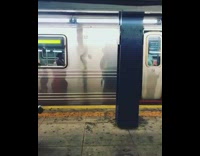 Two guys walk through subway station in viking costume and cardboard viking ship boat