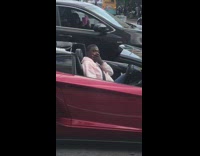 Tracy Morgan red convertible car pink sweater