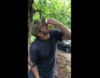 Guy drinking dunkin donuts coffee stabs hole shotguns cup