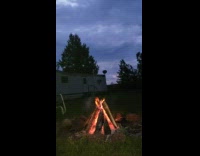 Time lapse bonfire fire white trailer sunset
