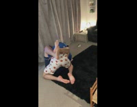 Two guys wrestling grandam watching on couch