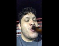 Guy bites off beer bottle cap with teeth and drinks beer