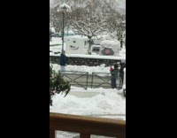 Guy juggle and throw snowballs to cameraman