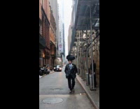 Collab WINY - Bald man in suit balance bag on head