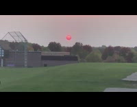 Red colored sun on sky during wildfire