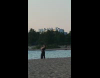 Lady dances on sand for video 