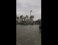 Three women exercise with music park two men watch