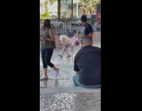 Guy kicks while doing handstand 