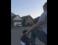 Guy stands on pick up truck trunk to jump on friend and falls down onto driveway