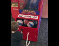Toddler boy wins tickets from basketball arcade game 
