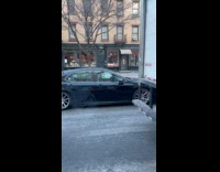 Car on road with Jason mask passenger