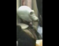 Person wears gas mask on subway 