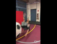 Guy jumps on giant soccer ball fail
