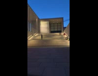 Black dress lady sings opera white stairs 