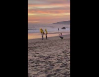 Mother make daughters hold 2021 balloons beach