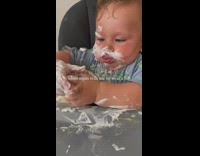 Toddler makes mess while eating yogurt 