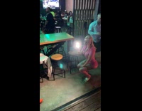 Collab IITW - Woman in black outfit orange boots small dance twerk at a club