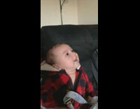 baby drops binky forehead kiss 