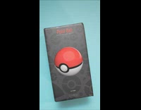 Person unboxes collectible pokeball 