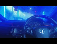 Person film inside car getting car wash