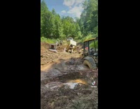 Bulldozers stuck under rocks 