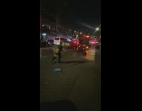 Man Throws Garbage Bags Inside Garbage Truck