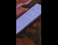 Guy read article on really smelly farts on phone on subway train