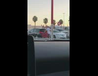 Man and woman acts for a video skit on the parking lot