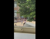 White shirt black pants girl rain bicycles  