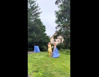 Womans dress is the same color as table cloth