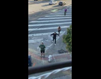 Man walk over fire hydrant cameraman follow