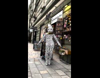 Woman wearing holographic geometric cat costume