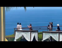 Woman beside newly wed photoshoot at resort