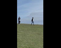 Man black jacket white shirt walk grass park