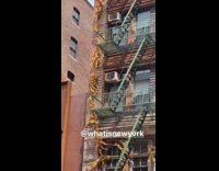 Human art surrounds fire escape 