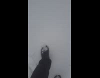 Filmer walks in snow with boots