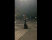 Green shorts guy kisses black lamppost park 