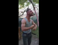 Guy in grey tanktop flexing hard and also screaming