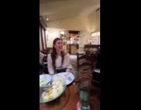 Waiter sings happy birthday to customer