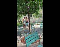 Two groups of women takes picture at the park