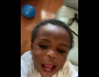 baby takes phone films selfie video 